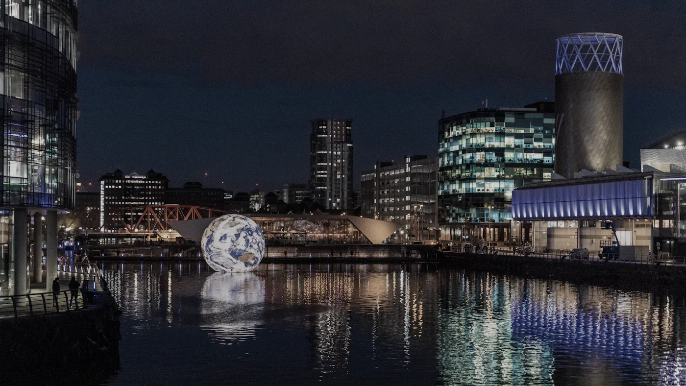 Salford Quays reflected in the water at night